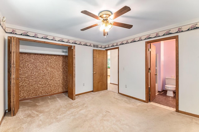 4104 Rurik Dr, Howell, MI 48843 - unfurnished bedroom featuring light colored carpet, ensuite bath, and ceiling fan