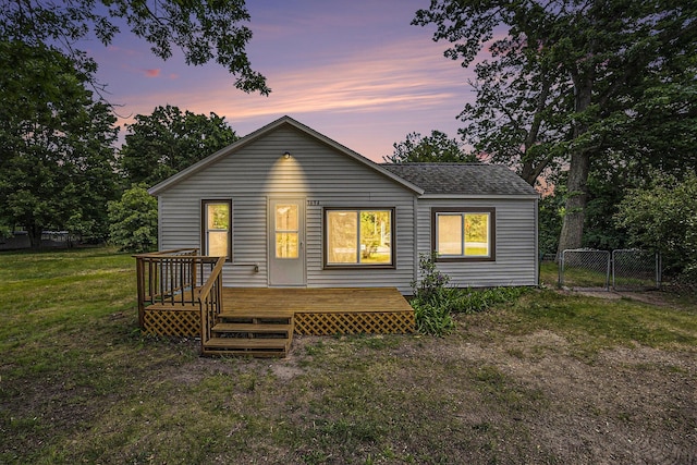 1694 S Mill Iron Rd, Muskegon, MI 49442 - rear view of property with a deck, a gate, and a shingled roof