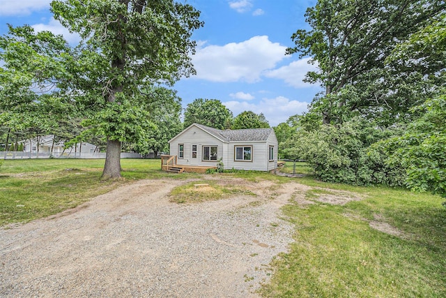 1694 S Mill Iron Rd, Muskegon, MI 49442 - view of front facade with driveway and a deck