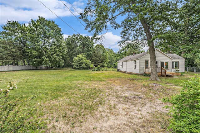 1694 S Mill Iron Rd, Muskegon, MI 49442 - view of yard featuring a wooden deck