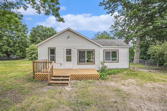1694 S Mill Iron Rd, Muskegon, MI 49442 - rear view of property featuring a gate, roof with shingles, and a deck