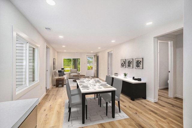 1694 S Mill Iron Rd, Muskegon, MI 49442 - dining room with light wood-type flooring and recessed lighting
