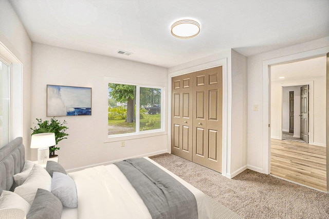 1694 S Mill Iron Rd, Muskegon, MI 49442 - bedroom with carpet floors and a closet