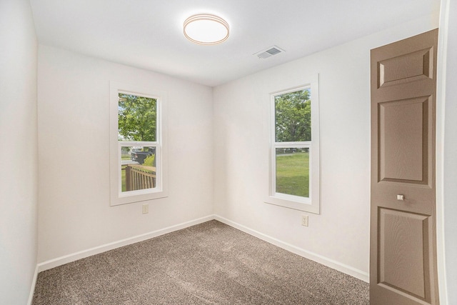 1694 S Mill Iron Rd, Muskegon, MI 49442 - carpeted spare room with baseboards
