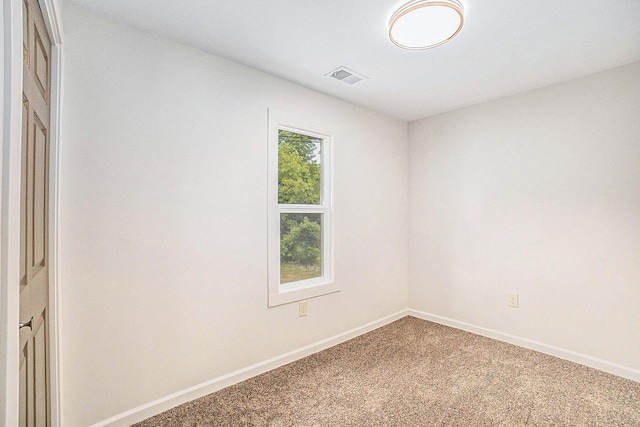1694 S Mill Iron Rd, Muskegon, MI 49442 - unfurnished room with carpet and baseboards