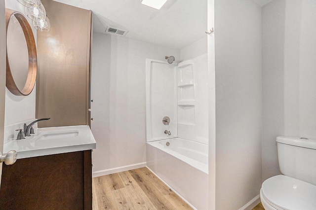1694 S Mill Iron Rd, Muskegon, MI 49442 - full bath featuring vanity, wood finished floors, and tub / shower combination