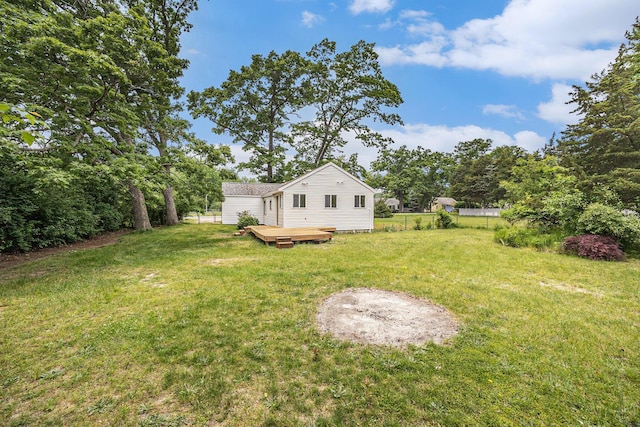 1694 S Mill Iron Rd, Muskegon, MI 49442 - view of yard with a deck
