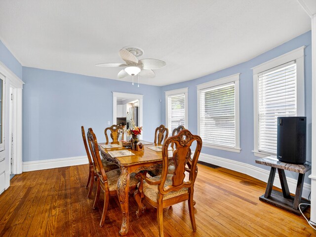 769 Evanston Ave, Muskegon, MI 49442 - dining room featuring light wood-type flooring and a ceiling fan