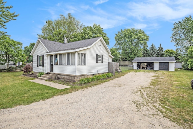 6710 28th Ave, Hudsonville, MI 49426 - ranch-style house with dirt driveway, a shingled roof, and a detached garage