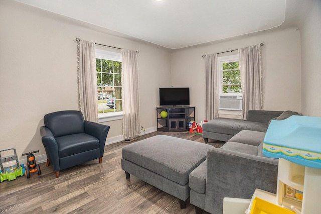 6710 28th Ave, Hudsonville, MI 49426 - living room with healthy amount of natural light, wood finished floors, and cooling unit