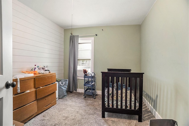 6710 28th Ave, Hudsonville, MI 49426 - bedroom with carpet flooring, wood walls, a crib, and cooling unit