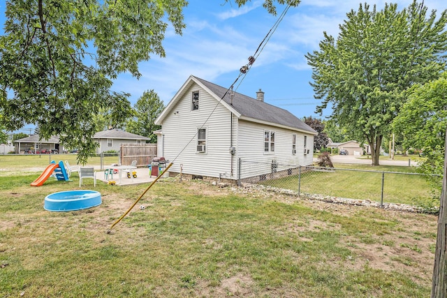 6710 28th Ave, Hudsonville, MI 49426 - view of side of property with a fenced backyard and a chimney