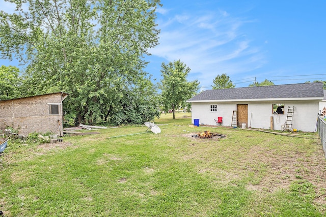 6710 28th Ave, Hudsonville, MI 49426 - view of yard featuring a fire pit and an outdoor structure