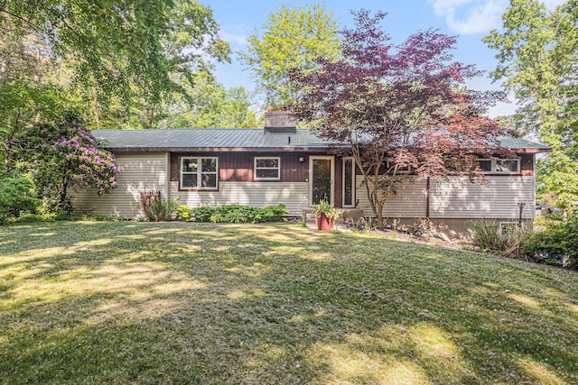 11738 Apple Dr, Nunica, MI 49448 - view of front of home with a front lawn