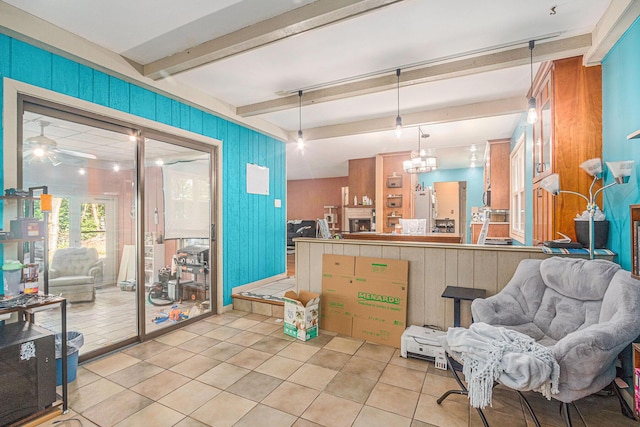 11738 Apple Dr, Nunica, MI 49448 - kitchen featuring freestanding refrigerator, light tile patterned floors, open floor plan, hanging light fixtures, and beamed ceiling