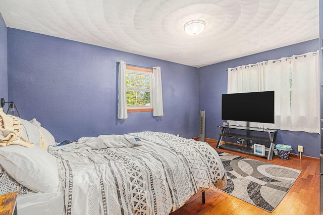 11738 Apple Dr, Nunica, MI 49448 - bedroom with wood finished floors and baseboards