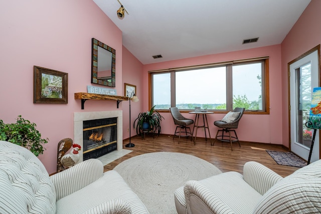 197 Wayne St, Saint Joseph, MI 49085 - living room with a tile fireplace, wood finished floors, and vaulted ceiling