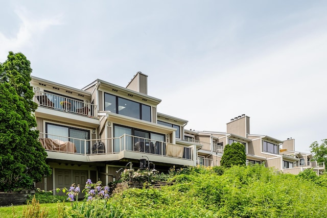 197 Wayne St, Saint Joseph, MI 49085 - back of property featuring a balcony and a chimney