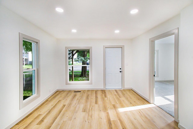 410 Warren Ave, Charlotte, MI 48813 - unfurnished room featuring wood finished floors and recessed lighting