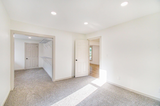 410 Warren Ave, Charlotte, MI 48813 - empty room with light colored carpet and recessed lighting
