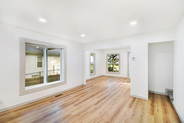 410 Warren Ave, Charlotte, MI 48813 - empty room with light wood finished floors and recessed lighting