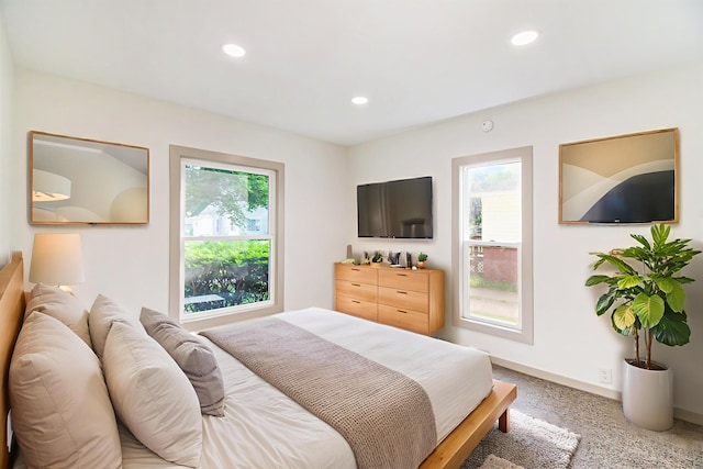 410 Warren Ave, Charlotte, MI 48813 - bedroom with light carpet and recessed lighting