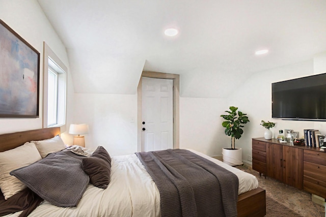 410 Warren Ave, Charlotte, MI 48813 - bedroom featuring vaulted ceiling, carpet, and recessed lighting