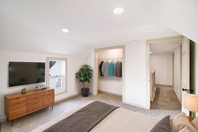 410 Warren Ave, Charlotte, MI 48813 - bedroom featuring light colored carpet, lofted ceiling, and recessed lighting