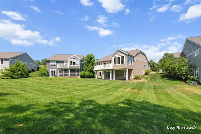 4441 Koinonia Dr NE Unit 3, Grand Rapids, MI 49525 - back of house with a lawn, a residential view, a balcony, and a sunroom