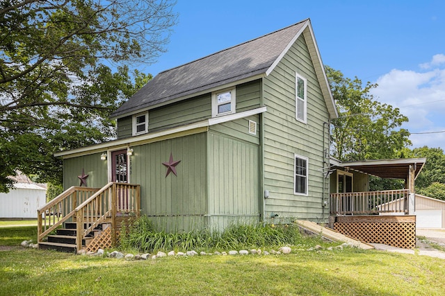 2943 108th Ave, Allegan, MI 49010 - view of side of home featuring a yard, a shingled roof, and a detached garage