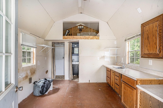 2943 108th Ave, Allegan, MI 49010 - kitchen with brown cabinets, vaulted ceiling, light countertops, and open shelves