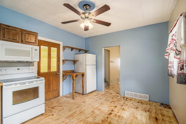 2943 108th Ave, Allegan, MI 49010 - kitchen with white appliances, a ceiling fan, and light wood-type flooring