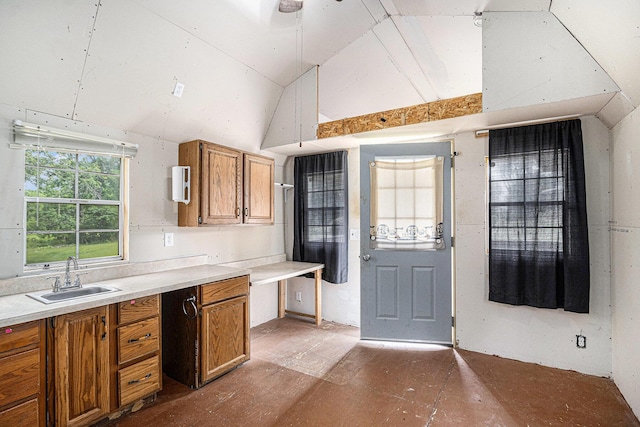2943 108th Ave, Allegan, MI 49010 - kitchen with brown cabinets, light countertops, a ceiling fan, and high vaulted ceiling
