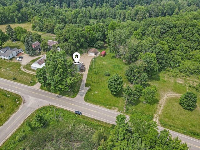 2943 108th Ave, Allegan, MI 49010 - aerial view of property and surrounding area featuring a heavily wooded area