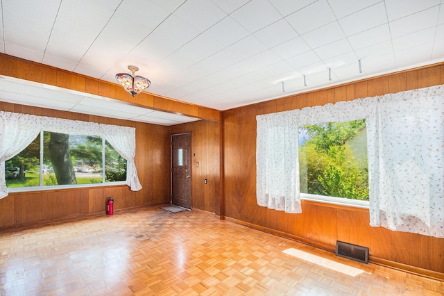 246 Ridgeway Rd, Jackson, MI 49202 - unfurnished room with wooden walls and baseboards