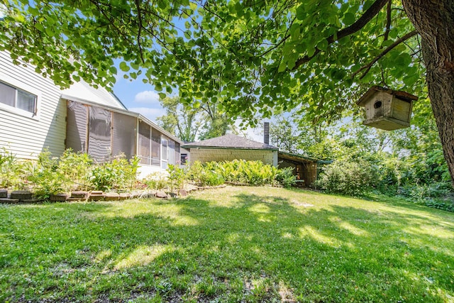 246 Ridgeway Rd, Jackson, MI 49202 - view of green lawn with a sunroom