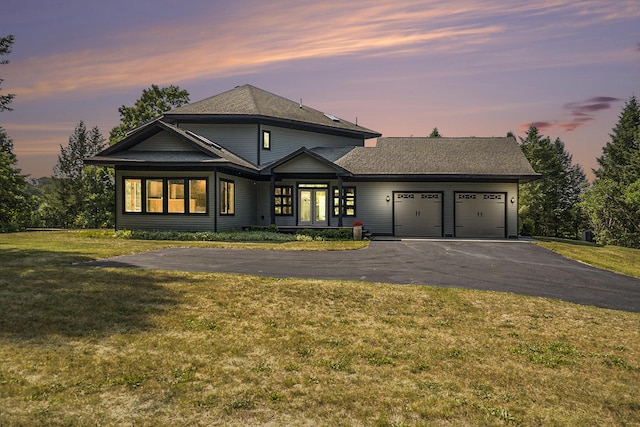6483 N 144th Ave, Walkerville, MI 49459 - view of front of house with a garage, asphalt driveway, and a front yard