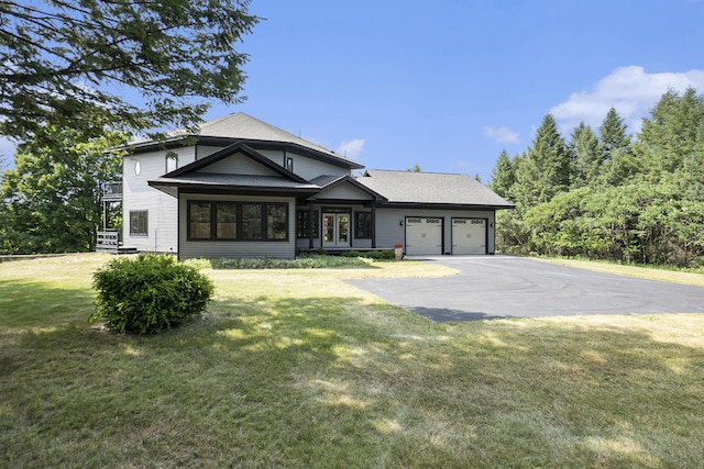 6483 N 144th Ave, Walkerville, MI 49459 - view of front of house featuring driveway, a garage, and a front lawn