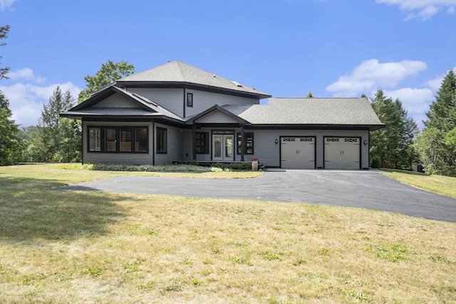 6483 N 144th Ave, Walkerville, MI 49459 - view of front of house with a garage, driveway, and a front lawn