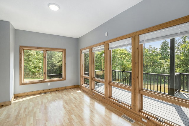 6483 N 144th Ave, Walkerville, MI 49459 - unfurnished sunroom with plenty of natural light and wood finished floors