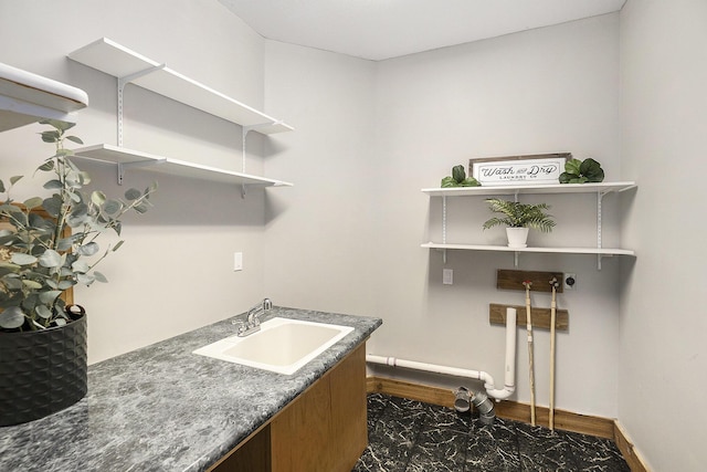 6483 N 144th Ave, Walkerville, MI 49459 - laundry area featuring dark marble finish flooring and baseboards