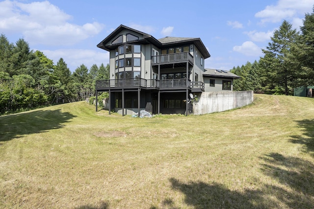 6483 N 144th Ave, Walkerville, MI 49459 - back of house featuring a balcony, a lawn, and a wooden deck