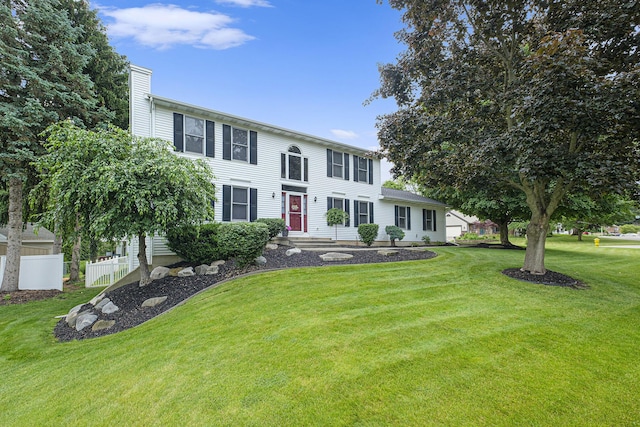 1863 Sunvale Dr SW, Wyoming, MI 49519 - colonial-style house featuring a chimney