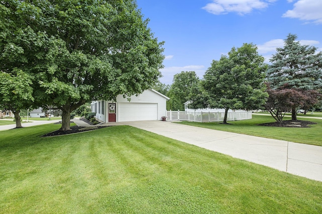 1863 Sunvale Dr SW, Wyoming, MI 49519 - obstructed view of property featuring concrete driveway and a garage