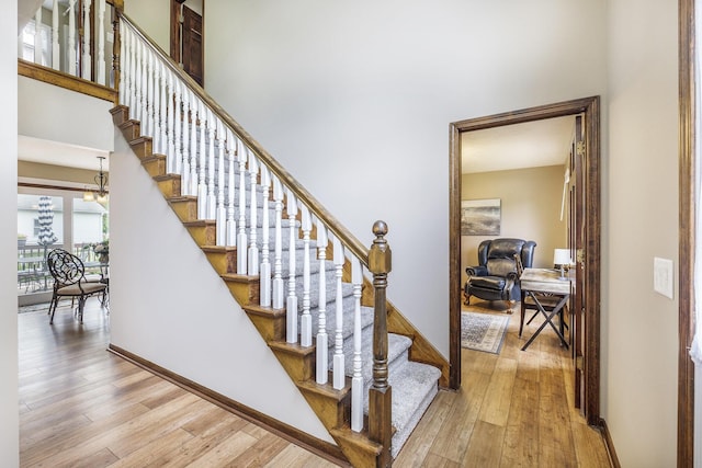 1863 Sunvale Dr SW, Wyoming, MI 49519 - stairs with hardwood / wood-style floors and baseboards