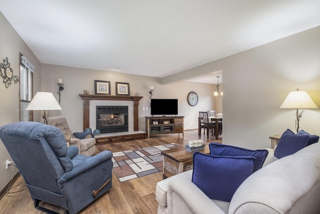 1863 Sunvale Dr SW, Wyoming, MI 49519 - living area featuring wood finished floors and a fireplace