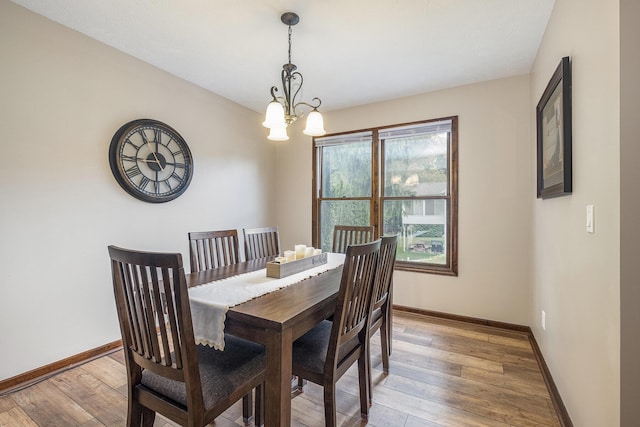 1863 Sunvale Dr SW, Wyoming, MI 49519 - dining space with light wood finished floors and a chandelier