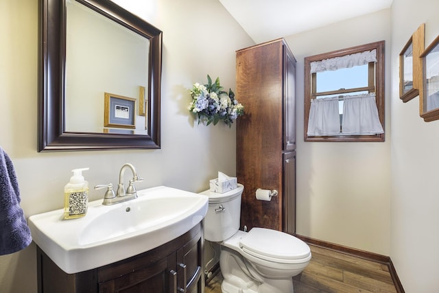 1863 Sunvale Dr SW, Wyoming, MI 49519 - bathroom with wood finished floors and vanity