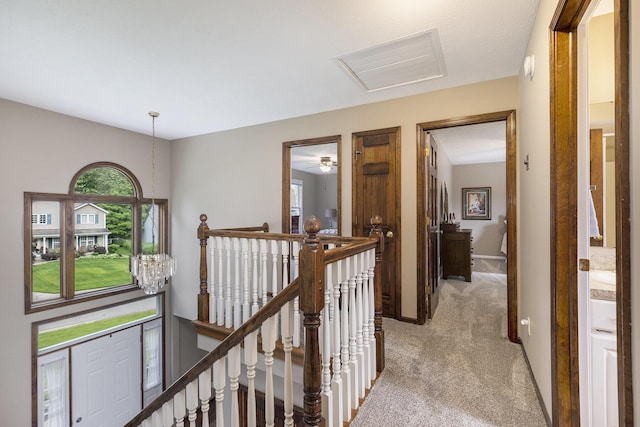 1863 Sunvale Dr SW, Wyoming, MI 49519 - corridor featuring an upstairs landing and light carpet