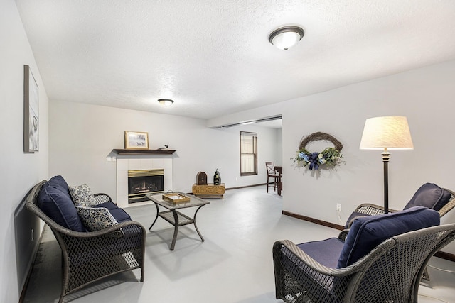 1863 Sunvale Dr SW, Wyoming, MI 49519 - living room featuring concrete flooring, a fireplace, and a textured ceiling